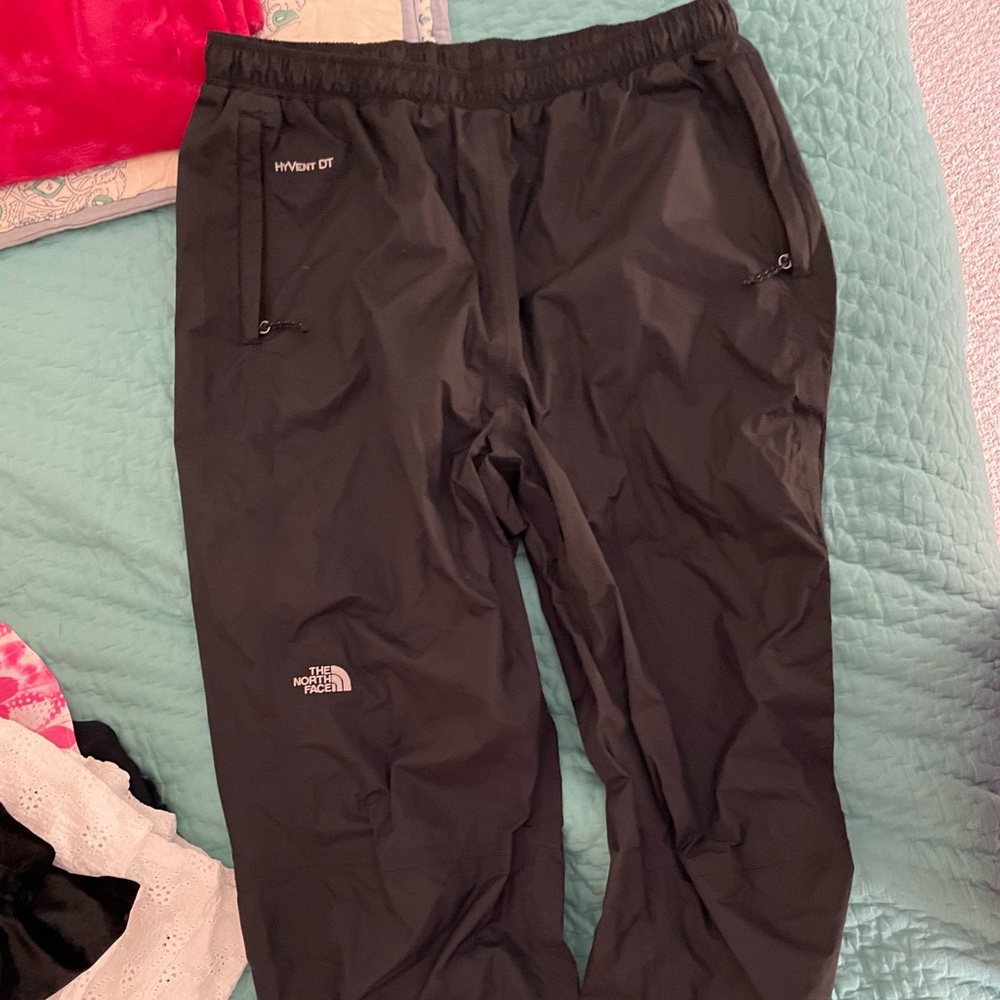 Black North Face waterproof wind pants.